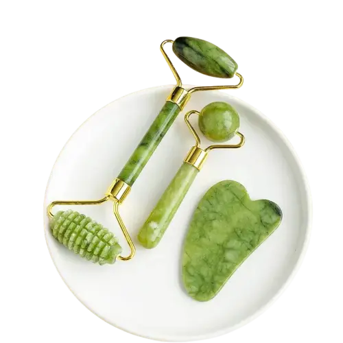 “Jade facial massage tool set including roller, gua sha, and textured tool for skincare.